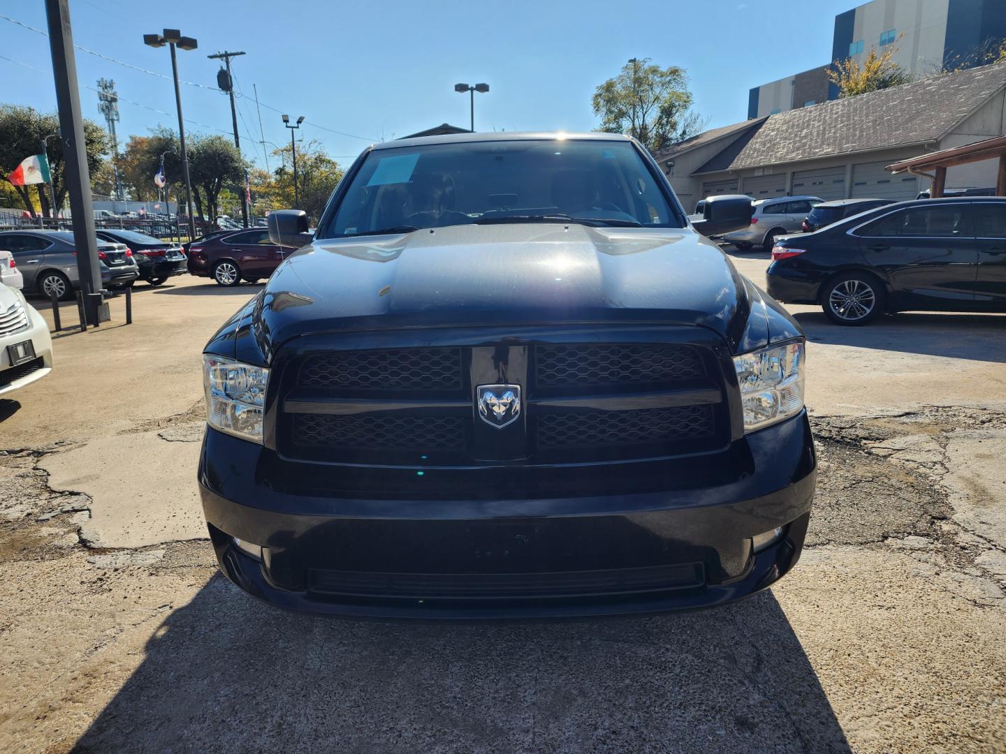 2012 Dodge Ram 1500 ST Quad Cab 4WD (1C6RD7FT2CS) with an 5.7L V8 OHV 16V engine, 6-Speed Automatic transmission, located at 945 E. Jefferson Blvd, Dallas, TX, 75203, (214) 943-7777, 32.752514, -96.811630 - Photo#1