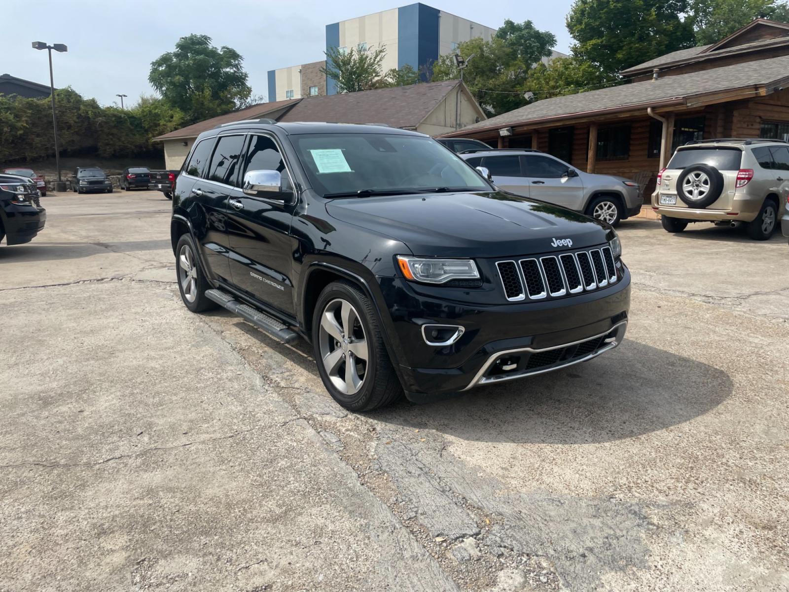 2014 Jeep Grand Cherokee Overland 4WD (1C4RJFCT9EC) with an 5.7L V8 OHV 16V engine, 5-Speed Automatic transmission, located at 945 E. Jefferson Blvd, Dallas, TX, 75203, (214) 943-7777, 32.752514, -96.811630 - Photo #3