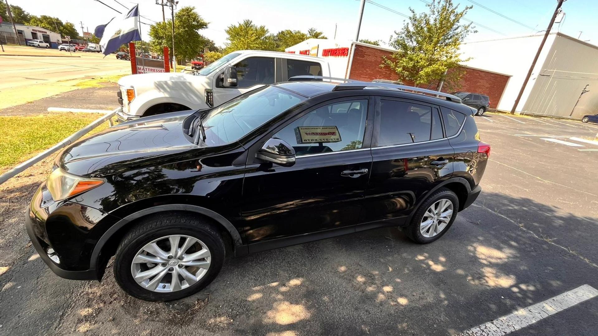 2015 Black Toyota RAV4 (2T3YFREV7FW) , located at 945 E. Jefferson Blvd, Dallas, TX, 75203, (214) 943-7777, 32.752514, -96.811630 - Photo#0