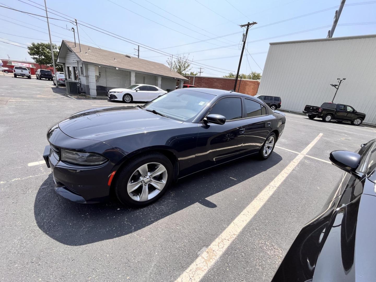 2016 Dodge Charger SXT (2C3CDXHG4GH) with an 3.6L V6 DOHC 24V engine, 8A transmission, located at 945 E. Jefferson Blvd, Dallas, TX, 75203, (214) 943-7777, 32.752514, -96.811630 - Photo#0
