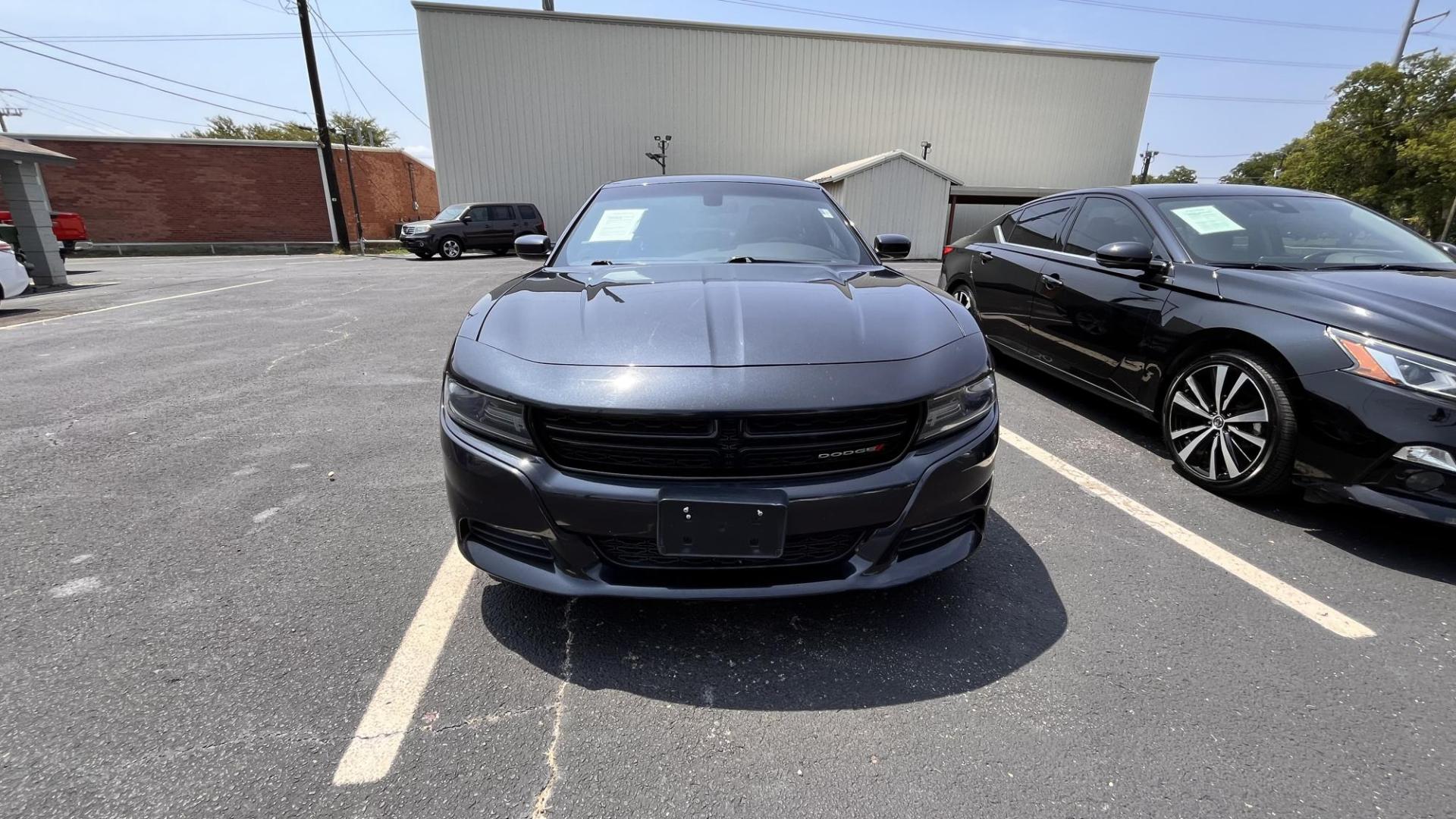 2016 Dodge Charger SXT (2C3CDXHG4GH) with an 3.6L V6 DOHC 24V engine, 8A transmission, located at 945 E. Jefferson Blvd, Dallas, TX, 75203, (214) 943-7777, 32.752514, -96.811630 - Photo#1