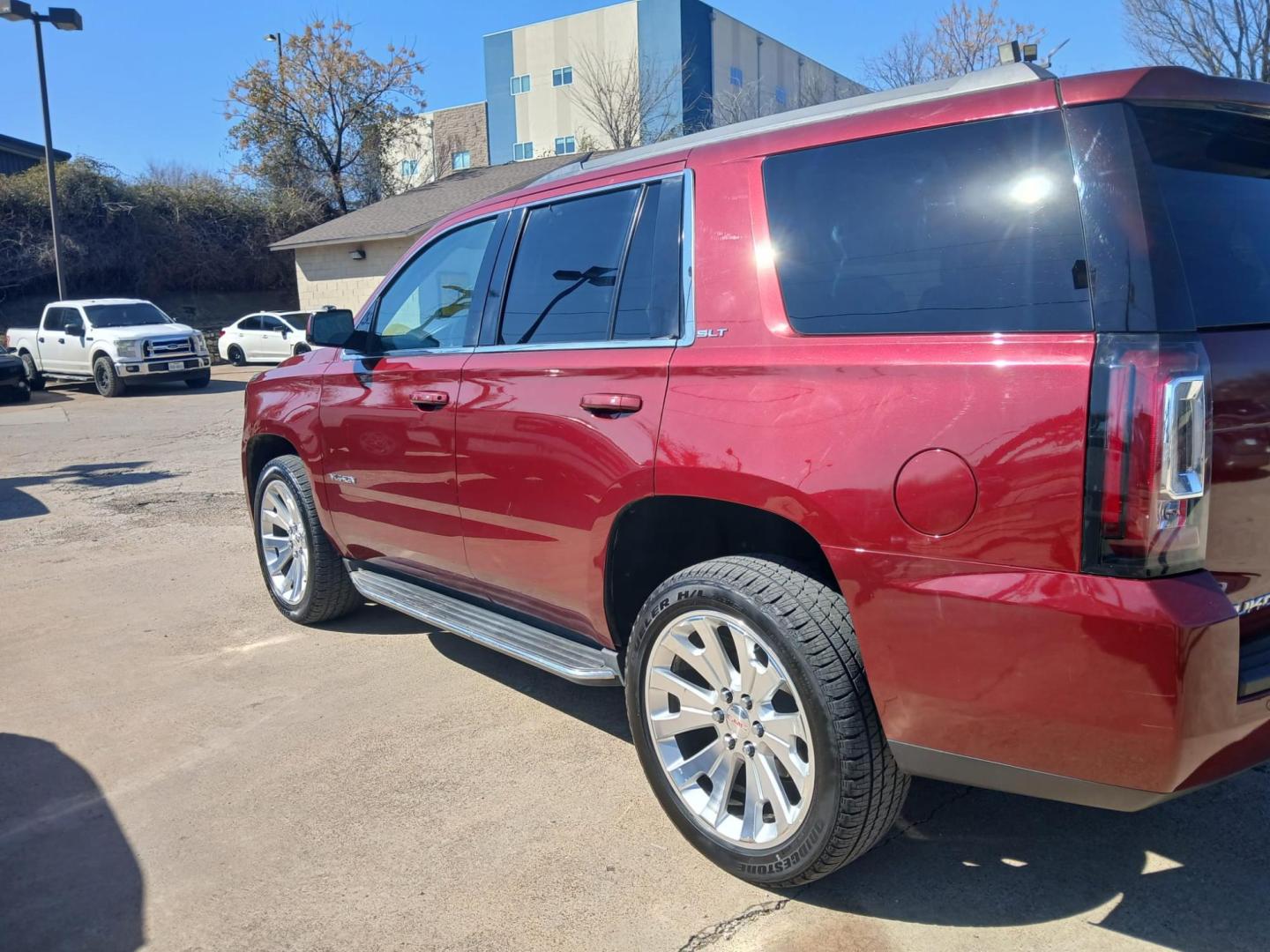 2016 Red GMC Yukon SLT 2WD (1GKS1BKC9GR) with an 5.3L V8 OHV 16V engine, 6A transmission, located at 945 E. Jefferson Blvd, Dallas, TX, 75203, (214) 943-7777, 32.752514, -96.811630 - Photo#0