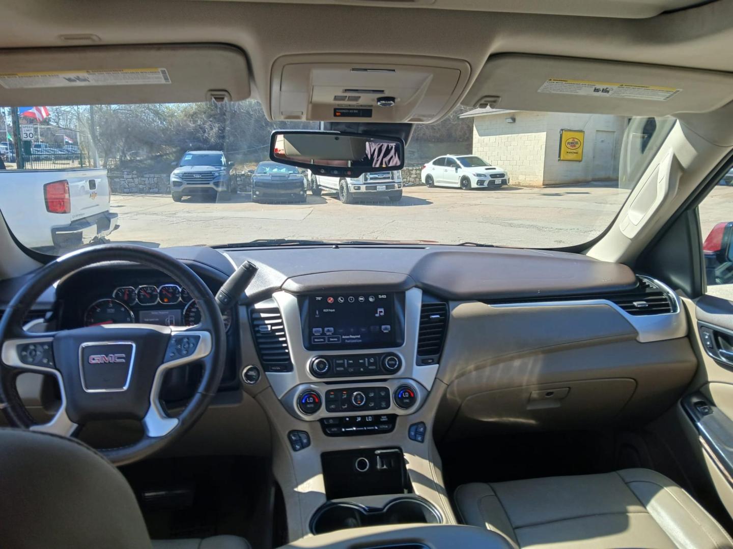 2016 Red GMC Yukon SLT 2WD (1GKS1BKC9GR) with an 5.3L V8 OHV 16V engine, 6A transmission, located at 945 E. Jefferson Blvd, Dallas, TX, 75203, (214) 943-7777, 32.752514, -96.811630 - Photo#4