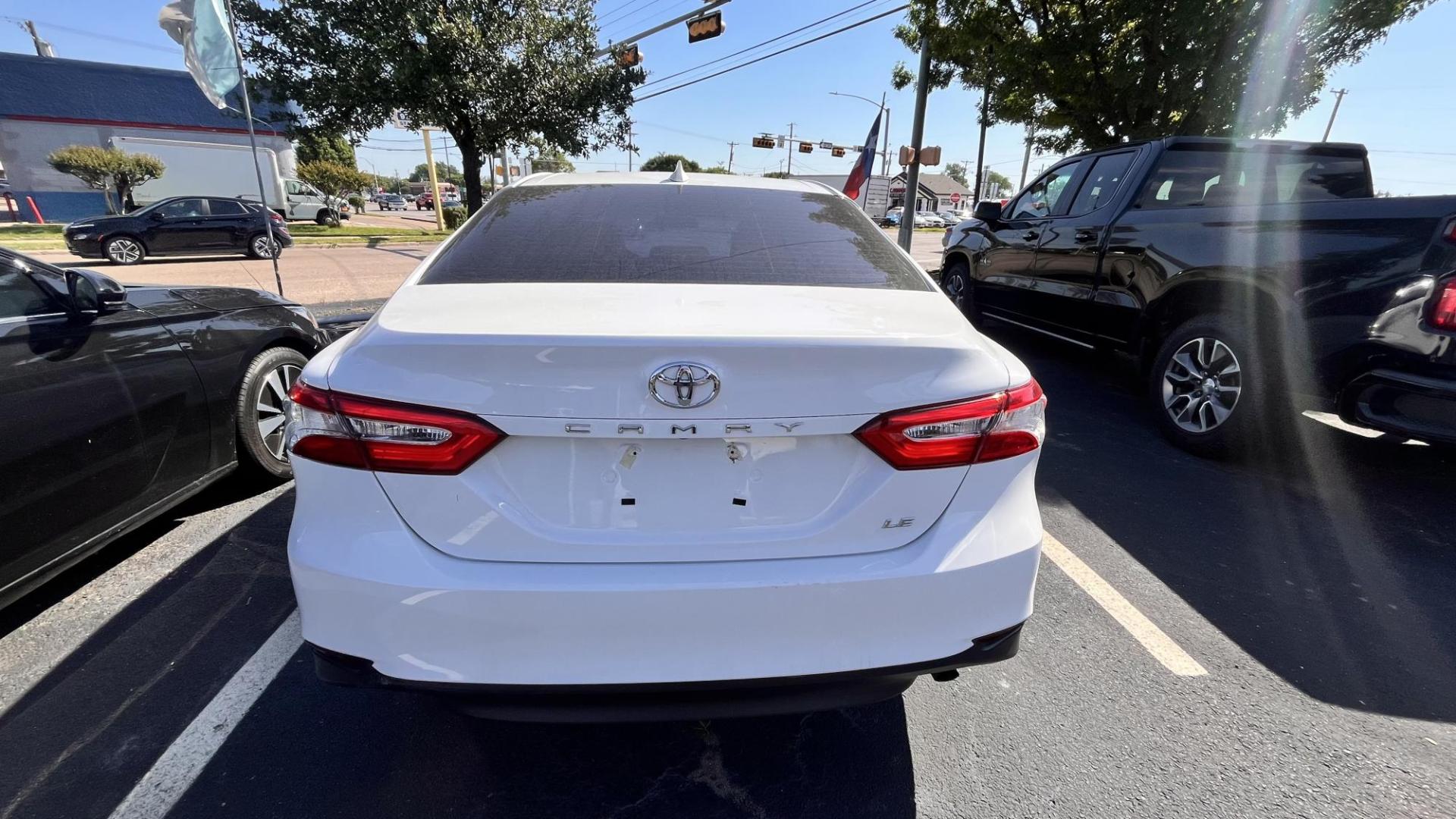 2020 White /Black Toyota Camry LE (4T1C11AK4LU) with an 2.5L L4 DOHC 16V engine, 8A transmission, located at 945 E. Jefferson Blvd, Dallas, TX, 75203, (214) 943-7777, 32.752514, -96.811630 - Photo#3