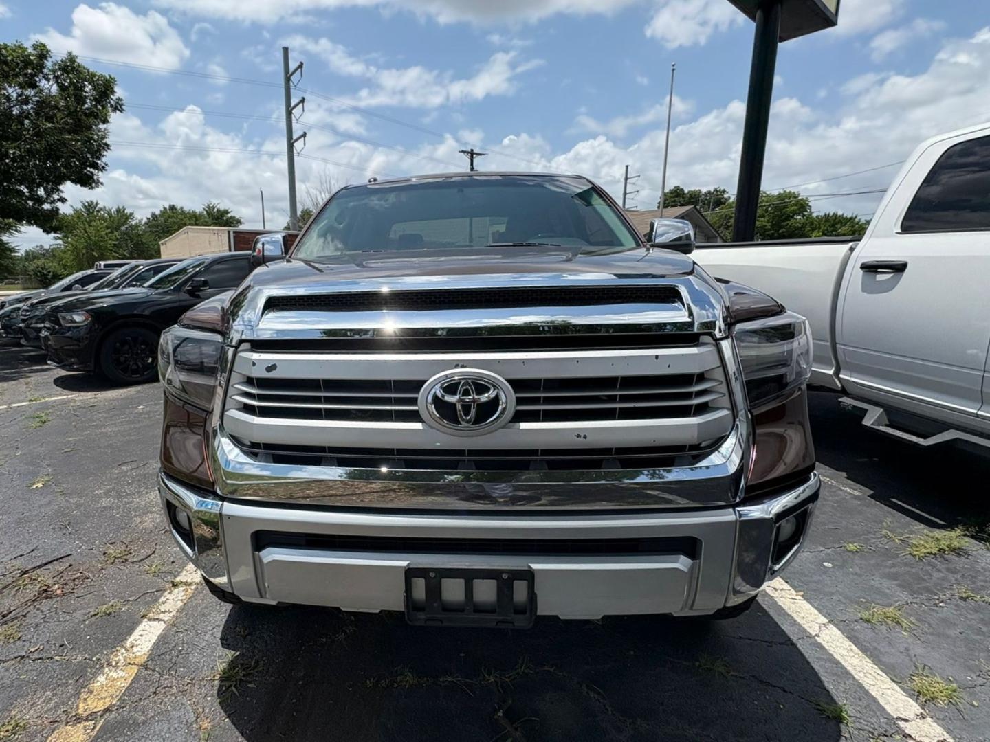 2014 Brown Toyota Tundra Platinum CrewMax 5.7L FFV 4WD (5TFAW5F10EX) with an 5.7L V8 DOHC 32V engine, 6-Speed Automatic transmission, located at 945 E. Jefferson Blvd, Dallas, TX, 75203, (214) 943-7777, 32.752514, -96.811630 - Photo#1