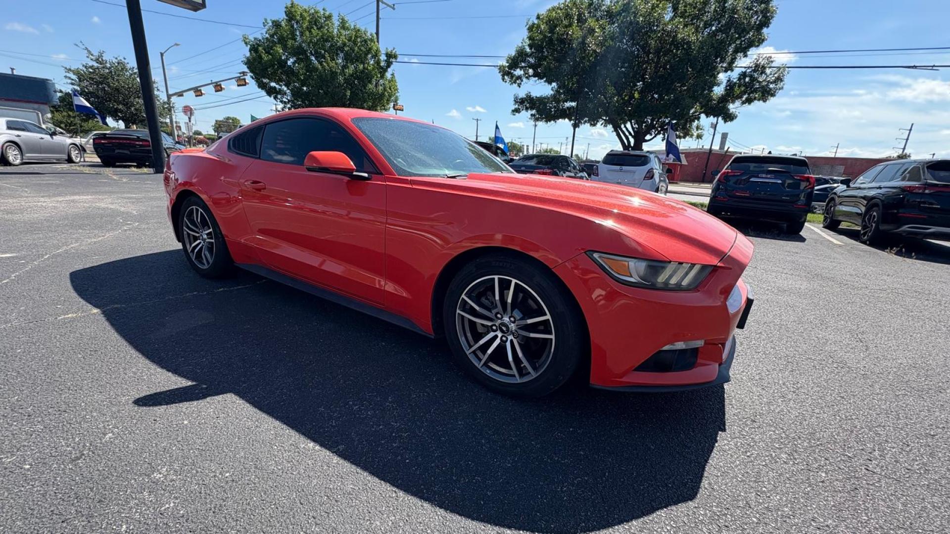 2016 Orange Ford Mustang EcoBoost Coupe (1FA6P8TH8G5) with an 2.3L L4 DOHC 16V engine, located at 945 E. Jefferson Blvd, Dallas, TX, 75203, (214) 943-7777, 32.752514, -96.811630 - Photo#2