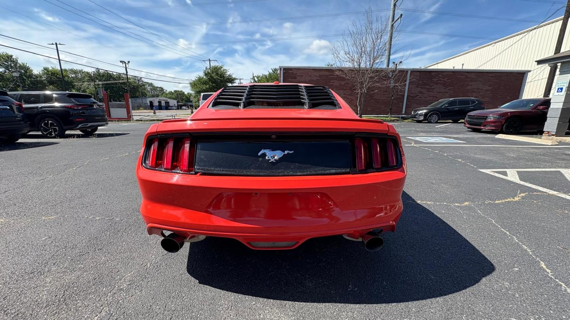 2016 Orange Ford Mustang EcoBoost Coupe (1FA6P8TH8G5) with an 2.3L L4 DOHC 16V engine, located at 945 E. Jefferson Blvd, Dallas, TX, 75203, (214) 943-7777, 32.752514, -96.811630 - Photo#3