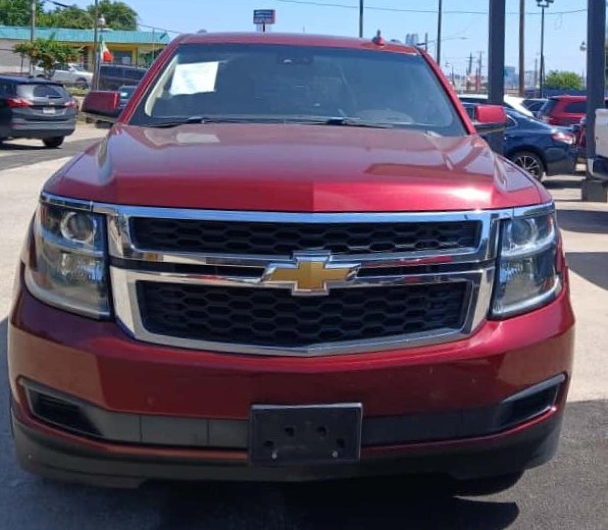 2016 Red Chevrolet Suburban LT 2WD (1GNSCHKC2GR) with an 5.3L V8 OHV 16V engine, 6A transmission, located at 945 E. Jefferson Blvd, Dallas, TX, 75203, (214) 943-7777, 32.752514, -96.811630 - Photo#1