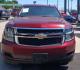 2016 Red Chevrolet Suburban LT 2WD (1GNSCHKC2GR) with an 5.3L V8 OHV 16V engine, 6A transmission, located at 945 E. Jefferson Blvd, Dallas, TX, 75203, (214) 943-7777, 32.752514, -96.811630 - Photo#1