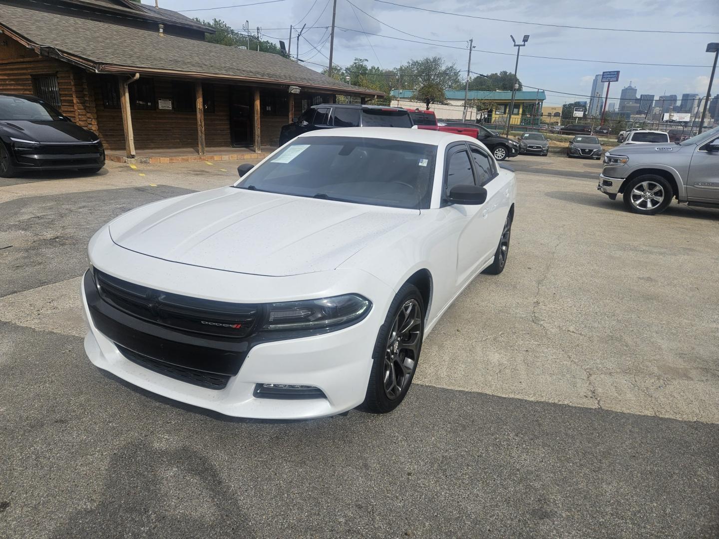 2016 /BLACK Dodge Charger SXT (2C3CDXHG4GH) with an 3.6L V6 DOHC 24V engine, 8A transmission, located at 945 E. Jefferson Blvd, Dallas, TX, 75203, (214) 943-7777, 32.752514, -96.811630- Photo#1