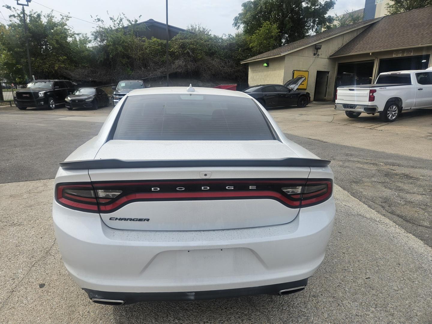 2016 /BLACK Dodge Charger SXT (2C3CDXHG4GH) with an 3.6L V6 DOHC 24V engine, 8A transmission, located at 945 E. Jefferson Blvd, Dallas, TX, 75203, (214) 943-7777, 32.752514, -96.811630- Photo#2